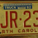 North Carolina license plate SJR 231 with a 1982 truck sticker and Jul