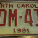 1981 YDM 413 North Carolina license plate with November 1989 stickers