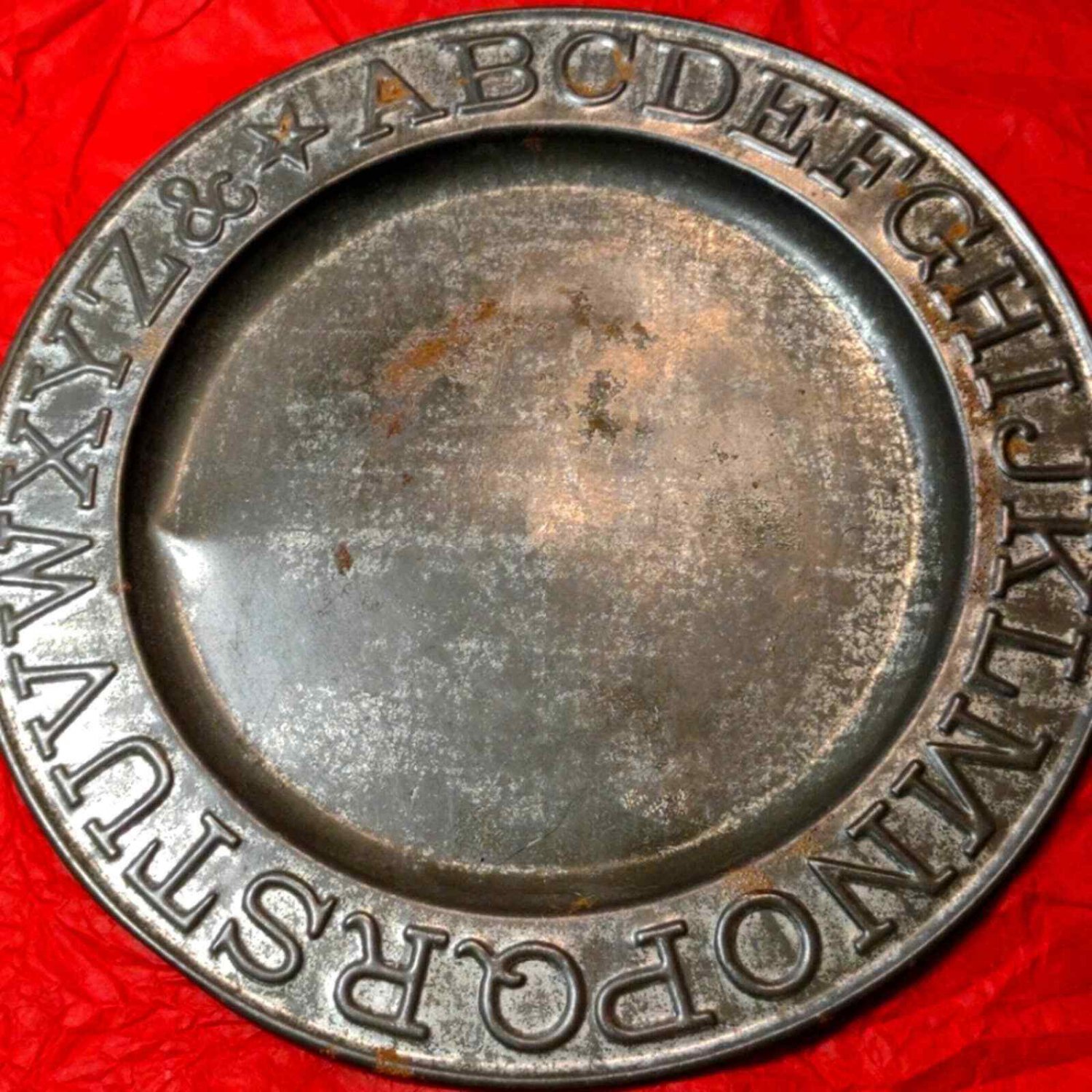 Late 1800s child metal alphabet plate