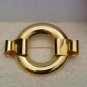 Round Gold Tone Brooch