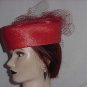 Red polystraw church pillbox hat net frou on back. No. 144