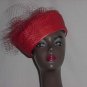 Red polystraw church pillbox hat net frou on back. No. 144