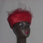 Red polystraw church pillbox hat net frou on back. No. 144