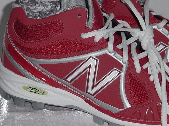 white and red new balance cleats