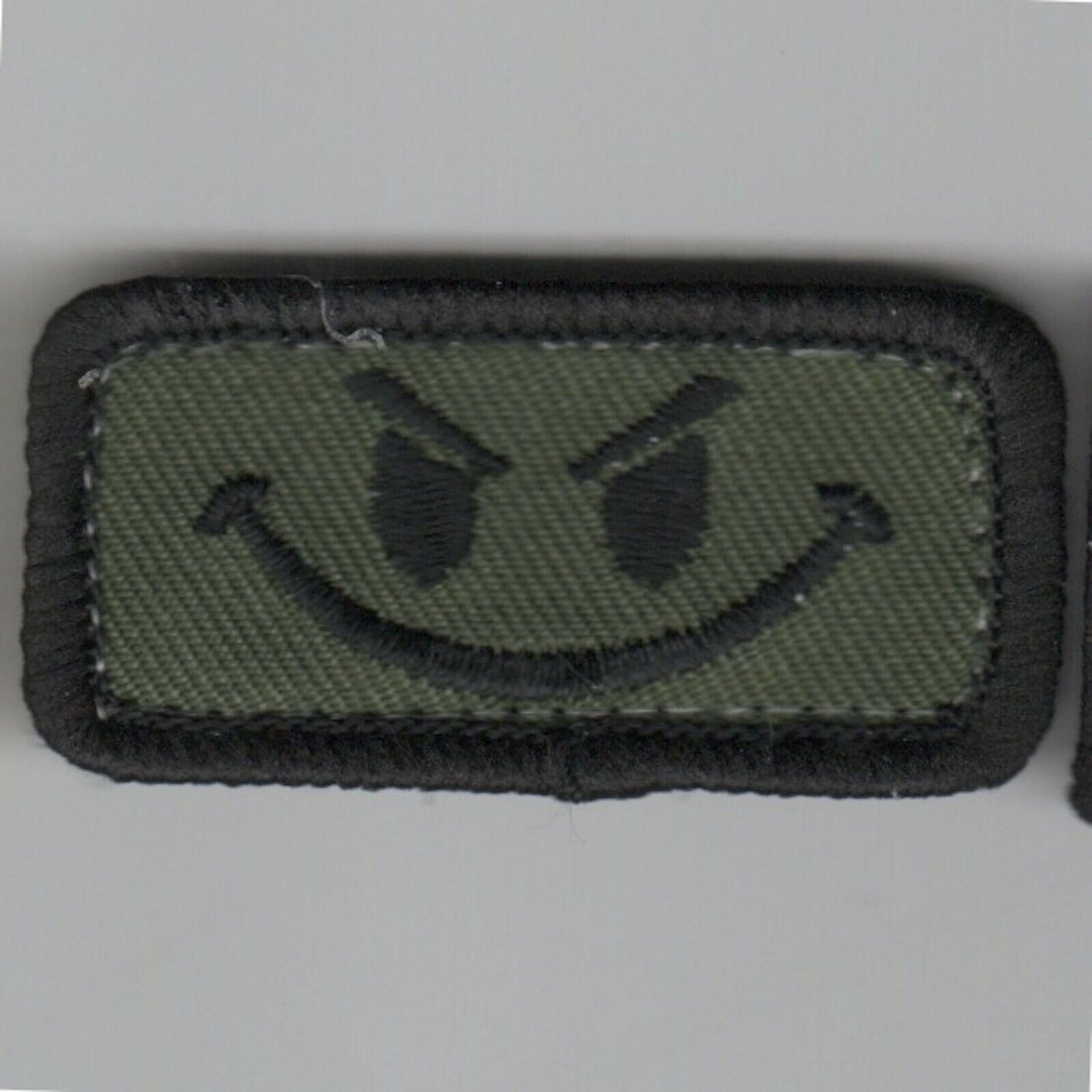 EVIL SMILEY FSS FLIGHT SUIT SLEEVE SUBDUED HOOK & LOOP EMBROIDERED PATCH