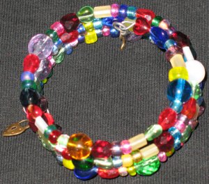 Golden lock and key on rainbow walk memory wire bracelet