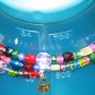 Golden lock and key on rainbow walk memory wire bracelet