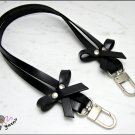 Black leather bag handle with bows, 52/62 cm. - silver / gold finishes