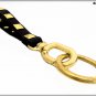Leather keychain with pyramidal studs, 6 colors available, length 13 cm, gold finishes.