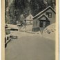 Real Photo Postcard - Homes on Hillside in Deep Snow