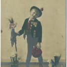Tinted Real Photo Postcard - Boy with Flowers c1910