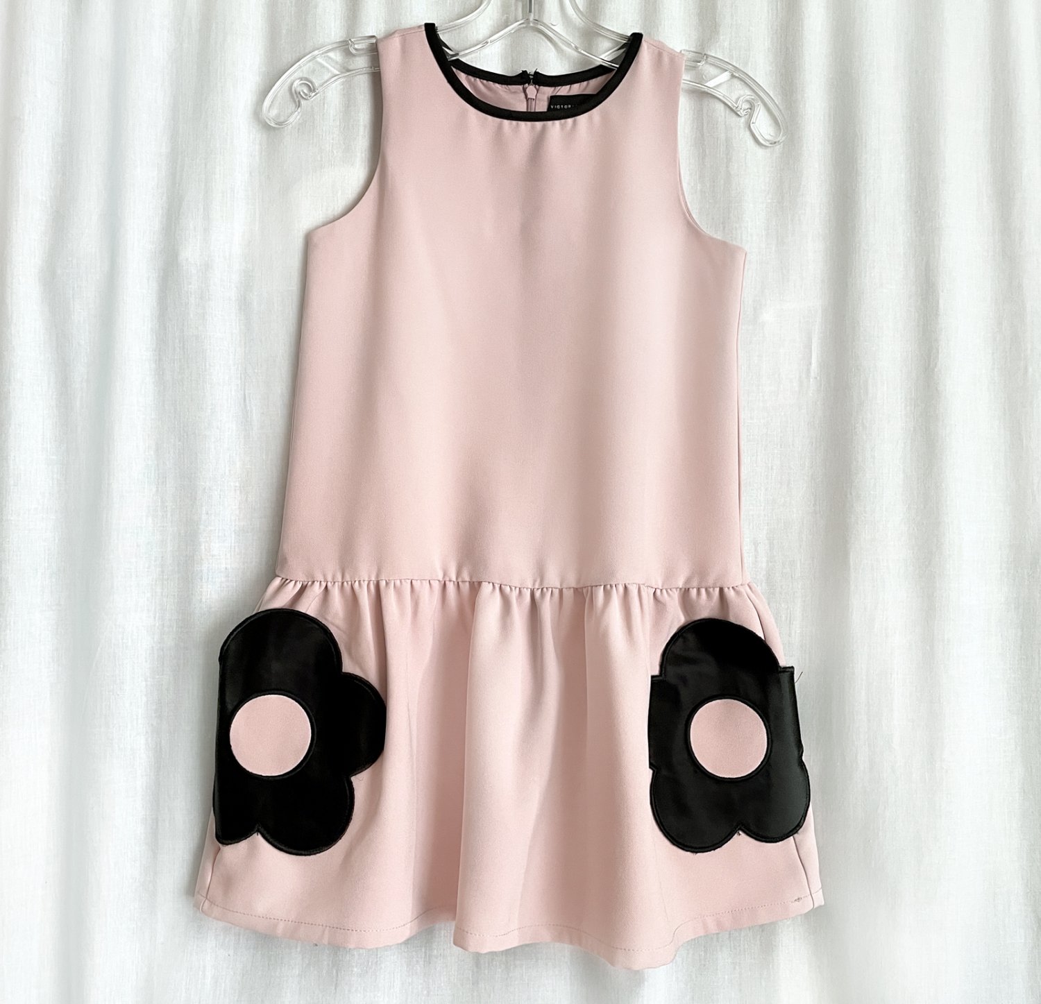Mini dres for girl or young teenager, light pink with black accents. Size M