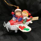 1998 Campbell Soup Kids Christmas Ornament Flying in a Plane Happy Holidays