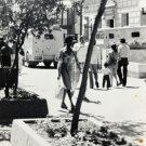 Vintage B&W Photo 70s City Street Armored Cars Women In Skirt People 3.5” x 5”