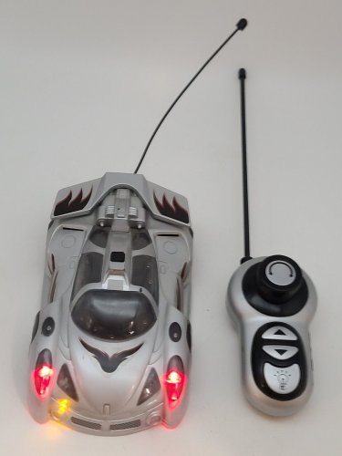 Remote Control Car Lights Up and Spins Silver *TESTED AND WORKING*