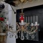 A beauty in red, with 6 light points, not a small chandelier. Vintage. Italy