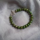 Green freshwater pearl bracelet with toggle clasp