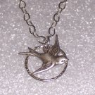 Sparrow Bird Necklace over a Sterling Hammered Circle and Sterling silver Chain