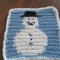 Christmas Crochet snowman dish cloth blue background