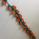 Handmade strap style orange flower bracelet