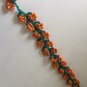 Handmade strap style orange flower bracelet
