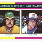 1975 Topps baseball card #311 (B) ERA Leaders Jim Catfish Hunter & Buzz Capra NM/M
