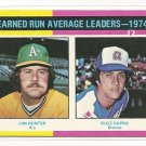 1975 Topps baseball card #311 (C) ERA Leaders Jim Catfish Hunter & Buzz Capra NM