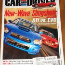 Car & Driver magazine June 2003 Subaru STi vs Mitsubishi EVO, Cadillac XLR, Porsche Carrera GT