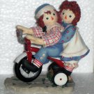 Happiness is Sharing a Cheery Smile Raggedy Ann & Andy Resin Figurine Tricycle 677752 Enesco NIB