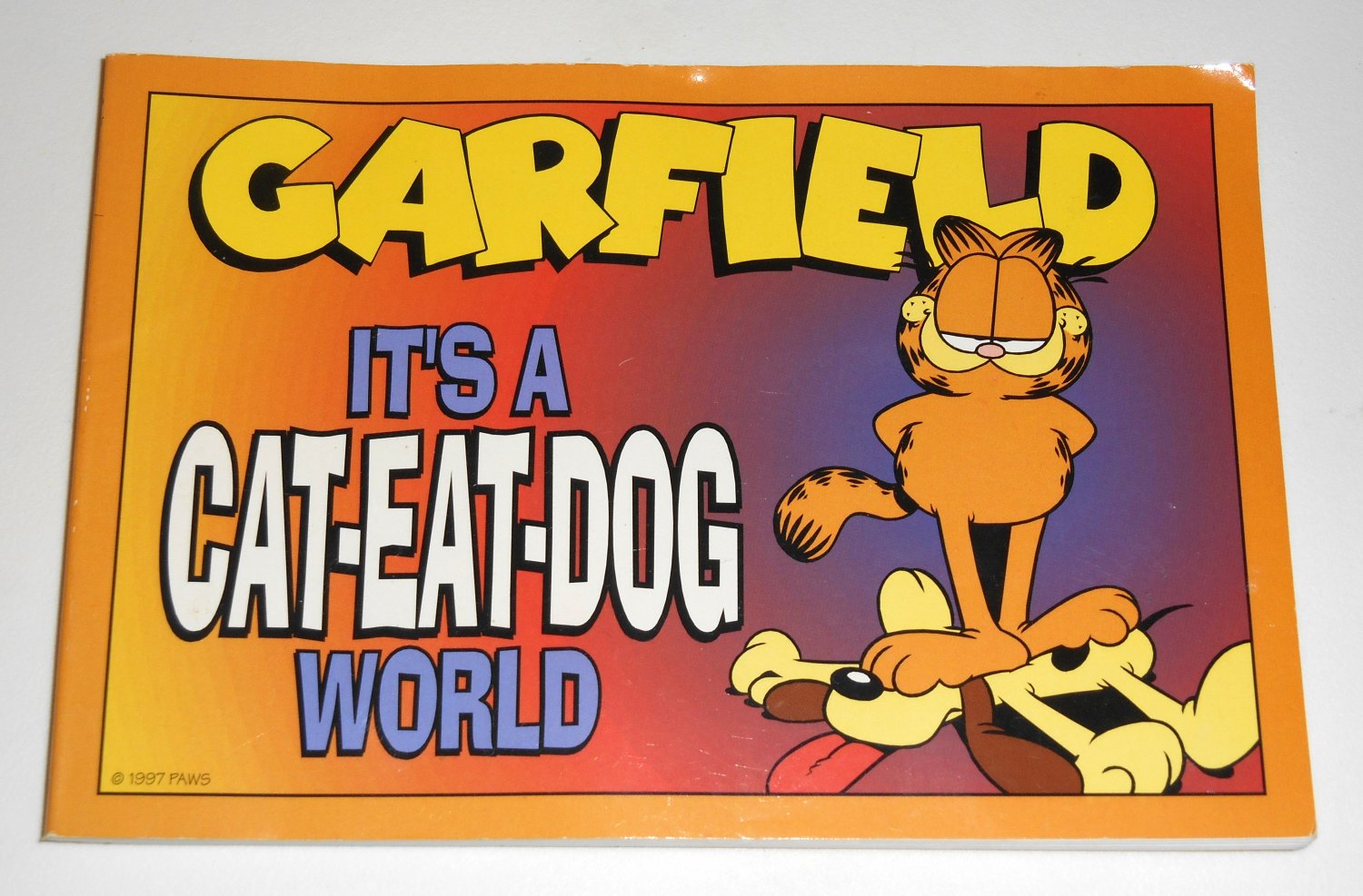 Garfield It's a Cat Eat Dog World Book Paperback Soft Cover Odie PAWS Jim Davis