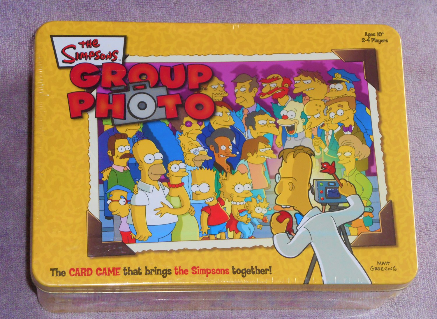 The Simpsons Group Photo Game in Tin Box Homer Marge Bart Lisa Maggie USAopoly 2003 NIB New in Box