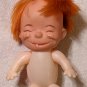 Vintage 4Â¾ Inch Plastic Caveman Doll One Single Tooth Grin Smiling Squinting Freckles Red Hair