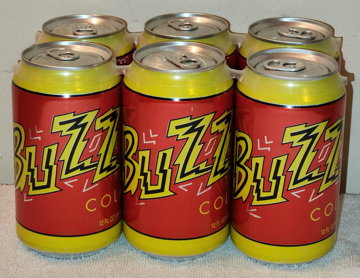 BUZZ Cola Soda Six 6 Pack 12 Ounce Cans In Plastic Ring Holder The Simpsons Movie 2007
