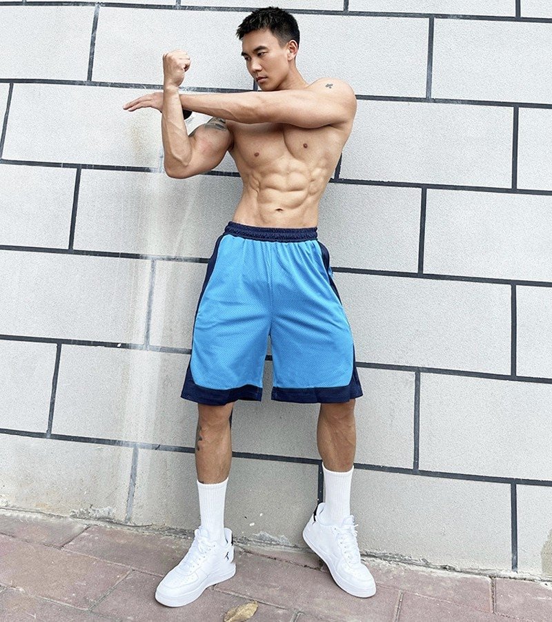 Men wearing hot sale basketball shorts