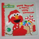 Sesame Street Have Yourself a Furry Little Christmas Board Book by Naomi Kleinberg