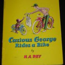 Vintage Curious George Rides a Bike by H. A. Rey 1952 Scholastic Paperback Book
