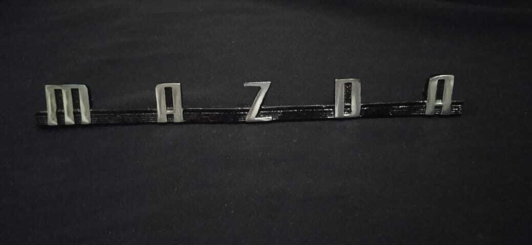 MAZDA Emblem In Metal