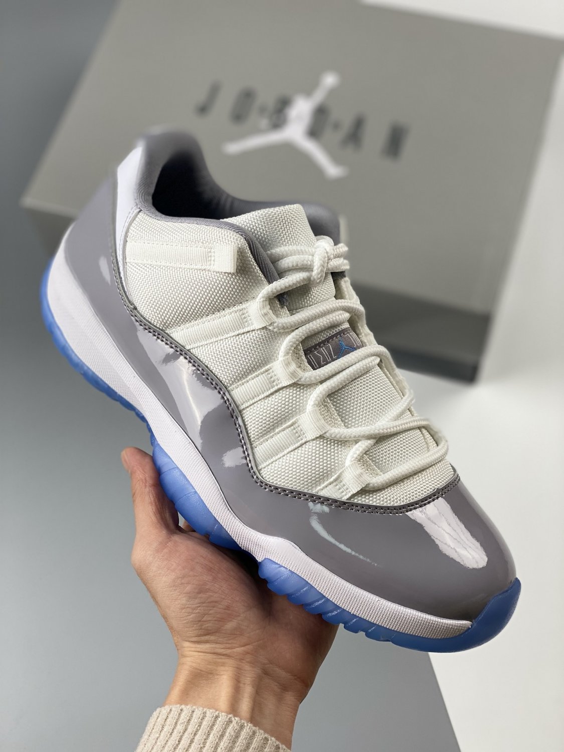 jordan 11 low whiteuniversity bluecement grey av2187-140