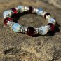 Garnet Red, with light crackle glass beads with silver flower crowns