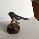 Miniature rose-breasted grosbeak. Bird carving