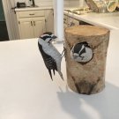 Downy woodpecker pair. Bird carving