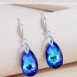 women's luxury earrings  drops wearing bright blue crystal pendant as a gift on an anniversary