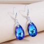 women's luxury earrings  drops wearing bright blue crystal pendant as a gift on an anniversary