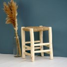 Handmade chair made of palm leaves and decorative wood