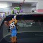 A Toy Story Woody rescue Buzz Doll Outside Car Hanging plush
