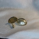 Pearl and gold clip earrings. (94c)