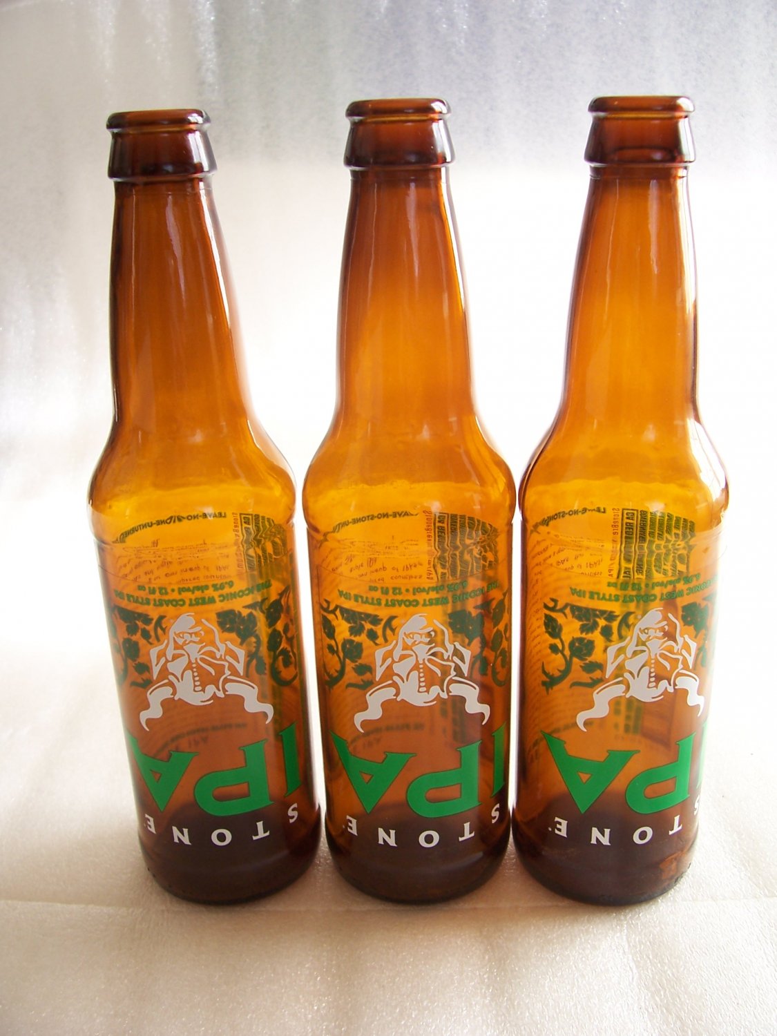 Three Stone IPA Leave No Stone Unturned 2020 Promo Upside-Down Empty Beer Bottles.