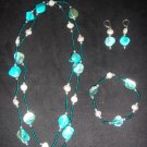 Turqoise stone with pearl and silver trio