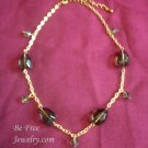 Gold and olive green beaded necklace
