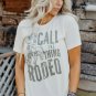 White AND THEY CALL THE THING RODEO Print Round Neck T Shirt
